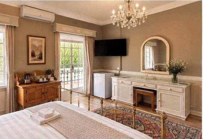 Bedroom 1 with television and dresser