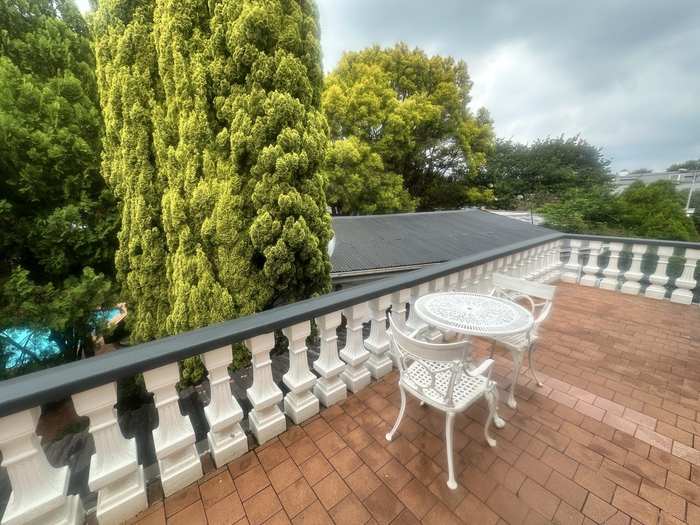 Private balcony overlooking the garden and pool