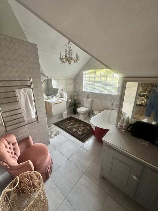 Shared bathroom towel rail and seating