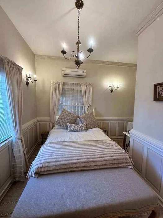 Deluxe Garden Room bedroom bathed in natural morning light