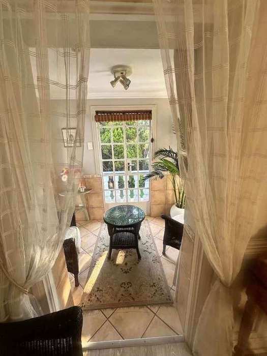 Private conservatory with wraparound garden windows