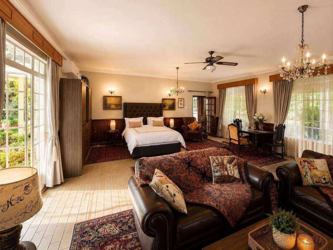 Panoramic view of the spacious Roy Graham Suite with Queen XL bed and lounge
