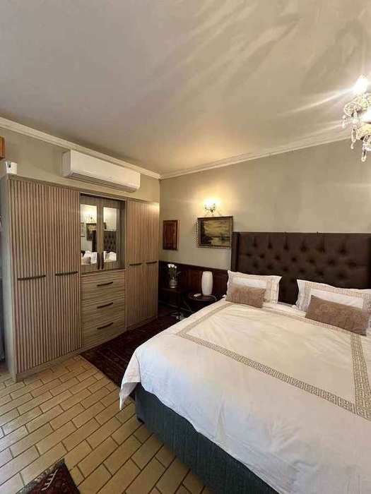 Spacious Roy Graham Suite with lounge and panoramic windows