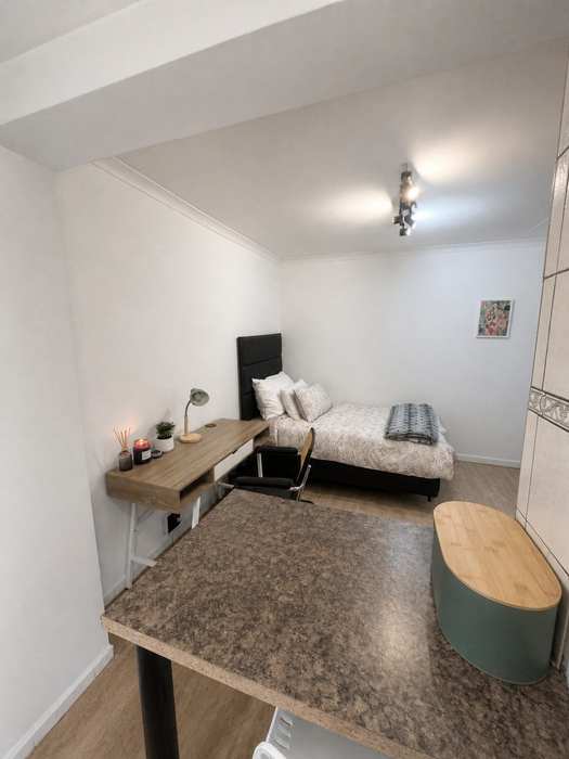 Study desk and seating in a furnished student unit
