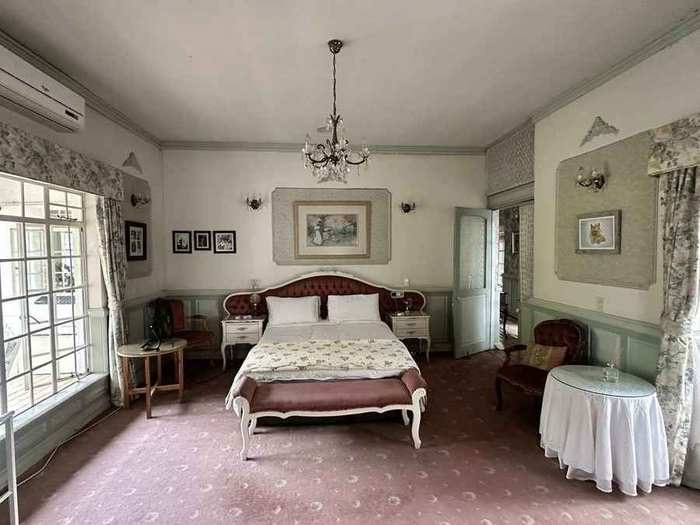 Heritage Suite balcony overlooking the garden and swimming pool
